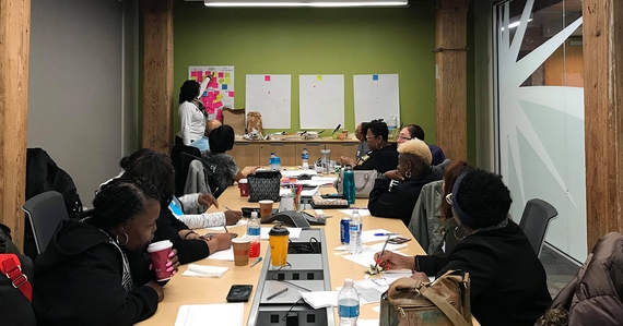 A childcare provider presenting her idea in front of a room of other childcare provider co-design participants